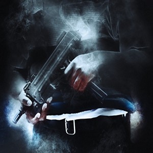 The midsection of a man holding an automatic weapon